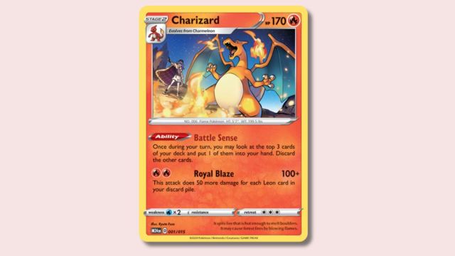 Charizard Pokémon card on a pink background.